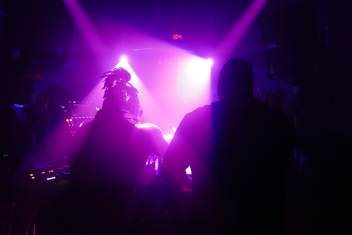 In the booth under club lights